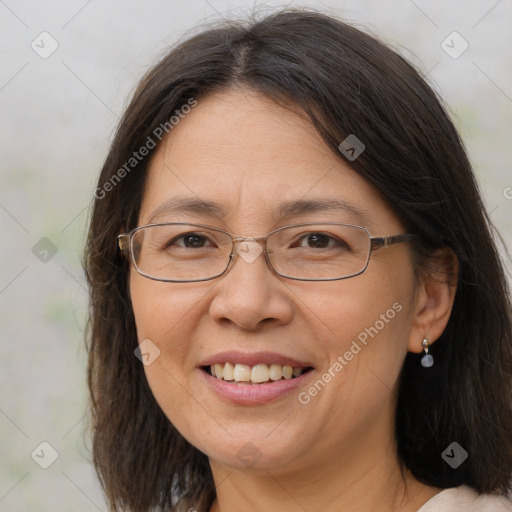 Joyful white adult female with long  brown hair and brown eyes