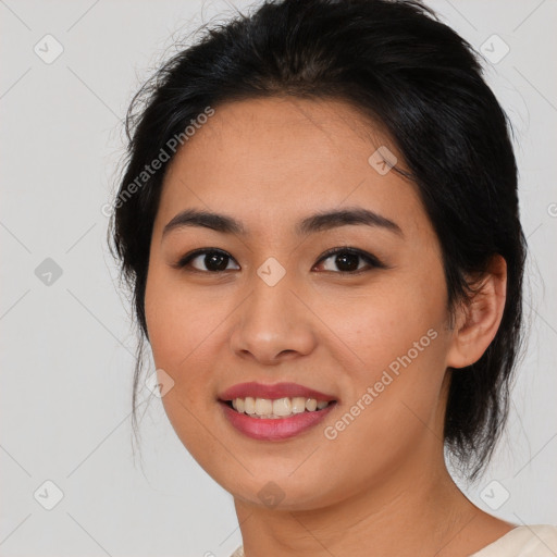 Joyful asian young-adult female with medium  black hair and brown eyes