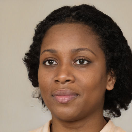 Neutral black young-adult female with medium  black hair and brown eyes