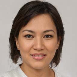 Joyful white young-adult female with medium  brown hair and brown eyes