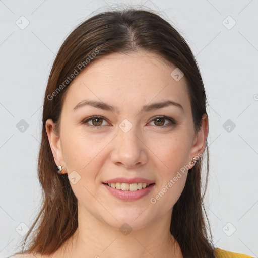 Joyful white young-adult female with long  brown hair and brown eyes