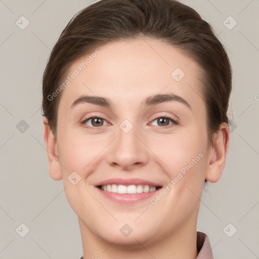 Joyful white young-adult female with short  brown hair and brown eyes