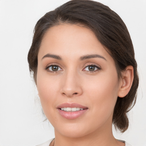 Joyful white young-adult female with medium  brown hair and brown eyes