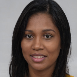 Joyful asian young-adult female with long  brown hair and brown eyes