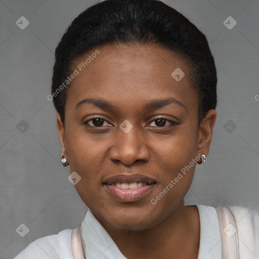 Joyful black young-adult female with short  black hair and brown eyes
