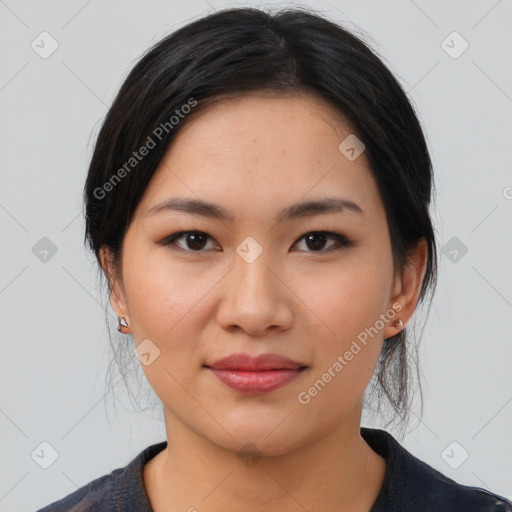 Joyful asian young-adult female with medium  black hair and brown eyes