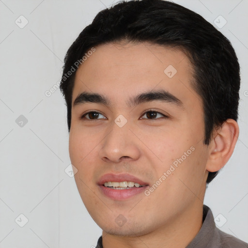 Joyful white young-adult male with short  black hair and brown eyes