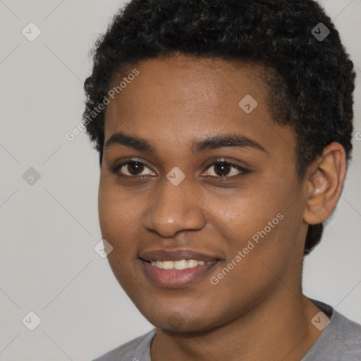 Joyful black young-adult female with short  black hair and brown eyes