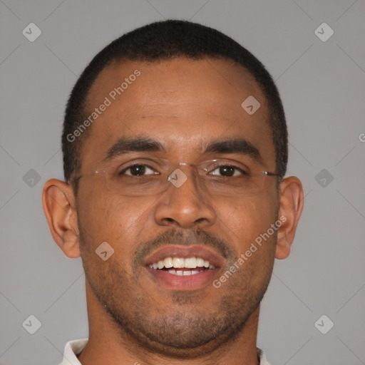 Joyful black young-adult male with short  brown hair and brown eyes