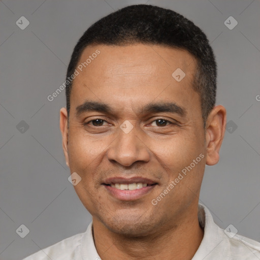 Joyful latino adult male with short  black hair and brown eyes