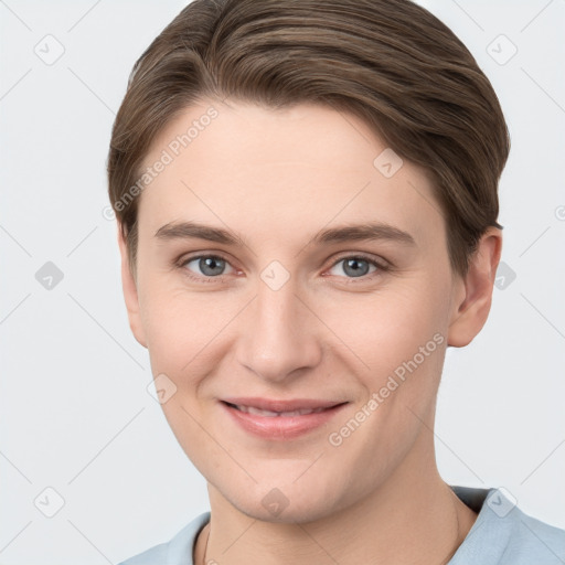 Joyful white young-adult female with short  brown hair and grey eyes