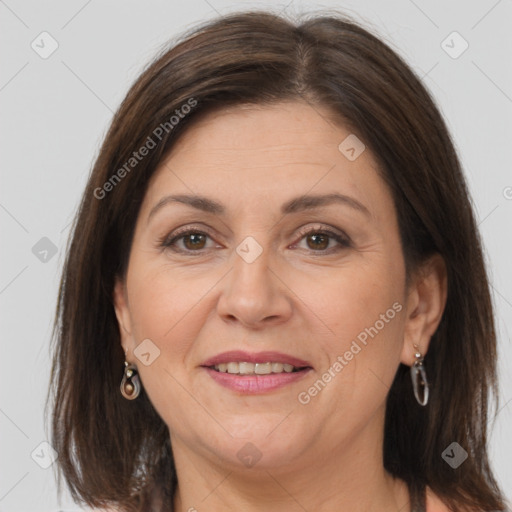 Joyful white adult female with medium  brown hair and grey eyes