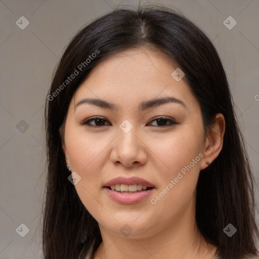 Joyful asian young-adult female with long  brown hair and brown eyes