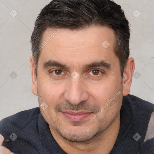 Joyful white adult male with short  brown hair and brown eyes