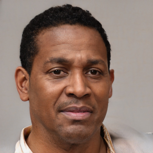 Neutral latino adult male with short  brown hair and brown eyes
