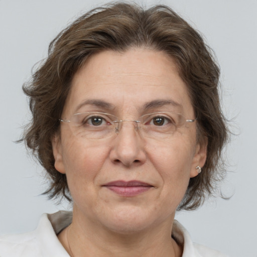 Joyful white middle-aged female with medium  brown hair and brown eyes