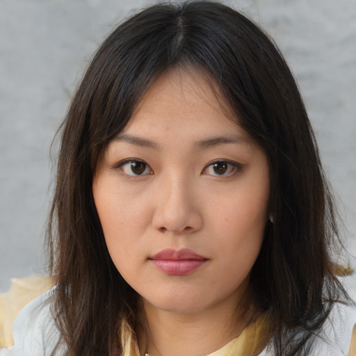 Neutral asian young-adult female with medium  brown hair and brown eyes