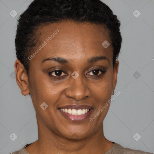 Joyful black young-adult female with short  black hair and brown eyes