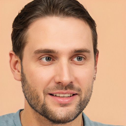 Joyful white young-adult male with short  brown hair and brown eyes