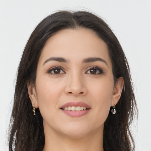 Joyful asian young-adult female with long  brown hair and brown eyes