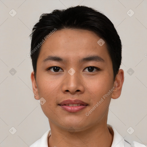 Joyful asian young-adult male with short  black hair and brown eyes