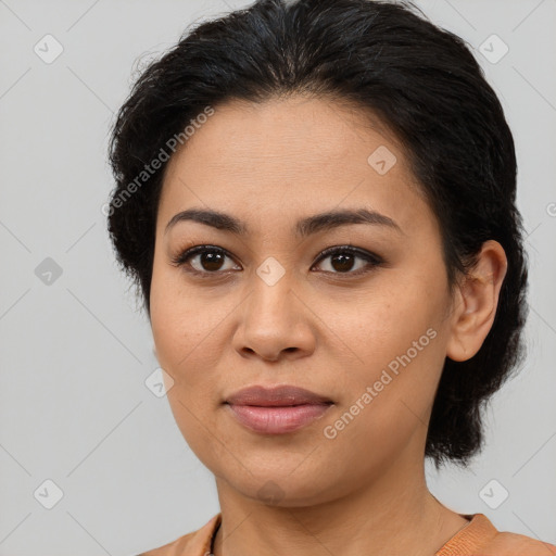 Joyful latino young-adult female with medium  brown hair and brown eyes