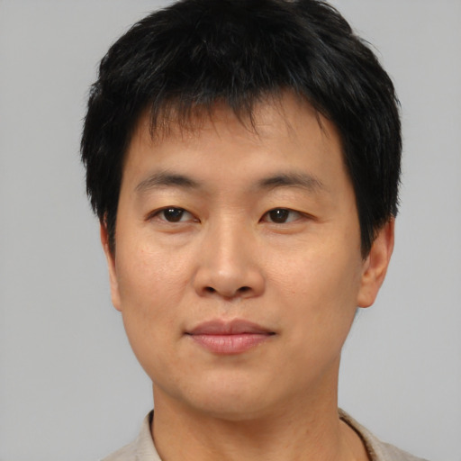 Neutral asian young-adult male with short  brown hair and brown eyes