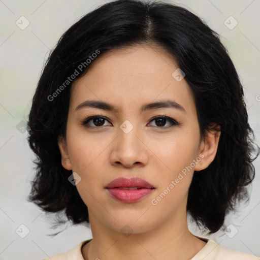 Joyful asian young-adult female with medium  black hair and brown eyes