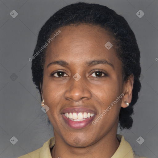 Joyful black adult female with short  brown hair and brown eyes