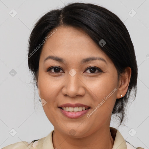 Joyful asian adult female with medium  brown hair and brown eyes