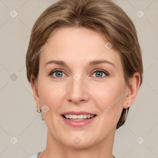 Joyful white adult female with short  brown hair and grey eyes