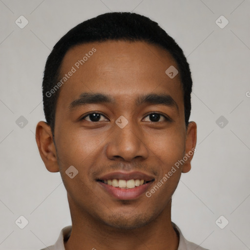 Joyful latino young-adult male with short  black hair and brown eyes
