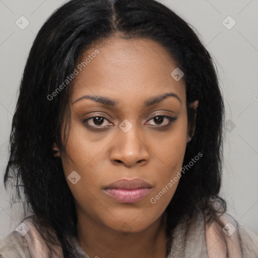 Joyful black young-adult female with long  brown hair and brown eyes