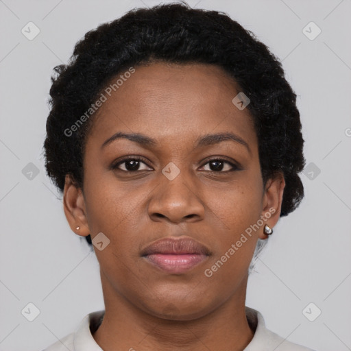 Joyful black adult female with short  brown hair and brown eyes