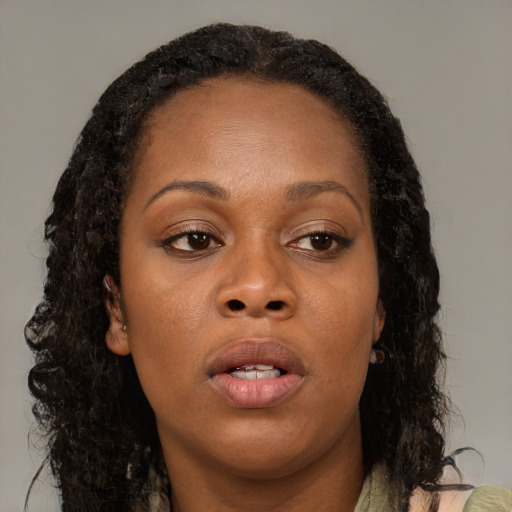 Neutral black adult female with long  brown hair and brown eyes