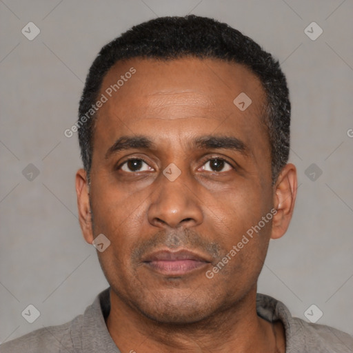 Neutral black adult male with short  black hair and brown eyes