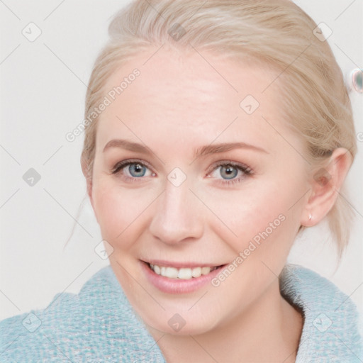 Joyful white young-adult female with medium  brown hair and blue eyes