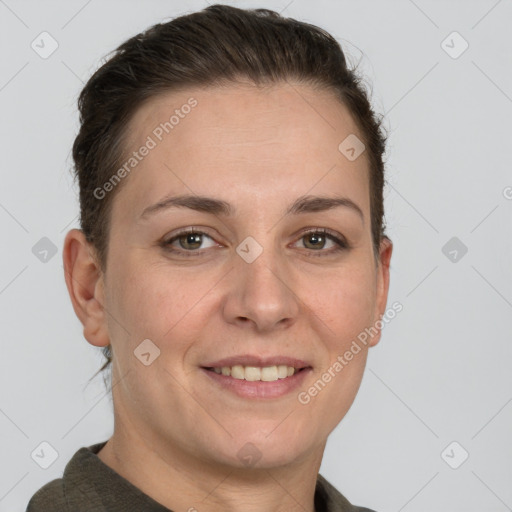 Joyful white adult female with short  brown hair and grey eyes