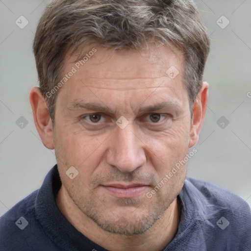 Joyful white adult male with short  brown hair and grey eyes