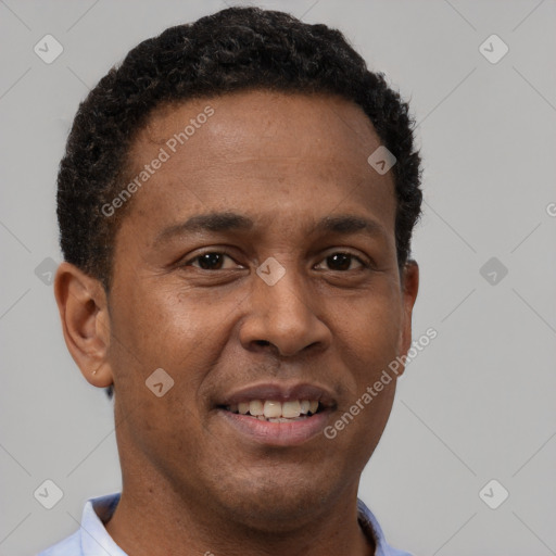 Joyful latino young-adult male with short  brown hair and brown eyes