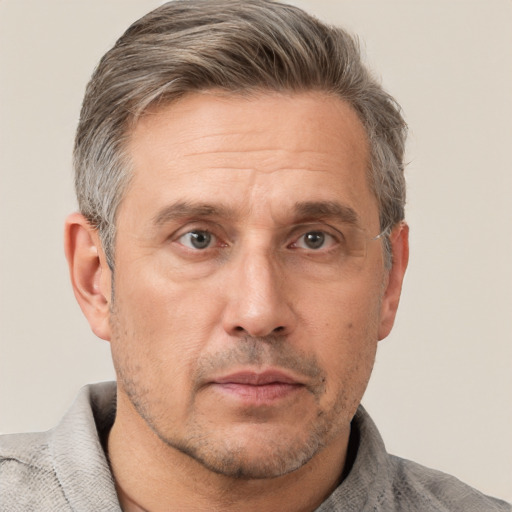 Neutral white middle-aged male with short  brown hair and brown eyes