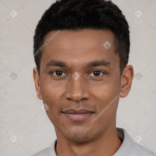 Joyful latino young-adult male with short  black hair and brown eyes