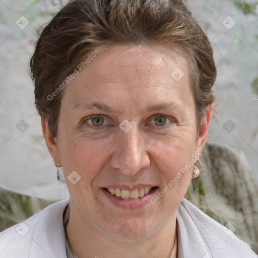 Joyful white adult female with short  brown hair and grey eyes