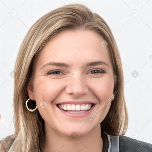 Joyful white young-adult female with long  brown hair and blue eyes