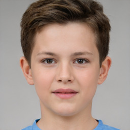 Joyful white child male with short  brown hair and brown eyes