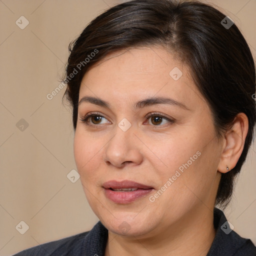 Joyful white adult female with medium  brown hair and brown eyes