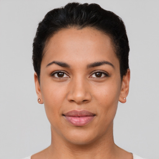 Joyful latino young-adult female with short  black hair and brown eyes