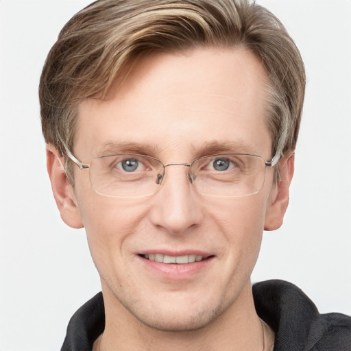 Joyful white adult male with short  brown hair and grey eyes