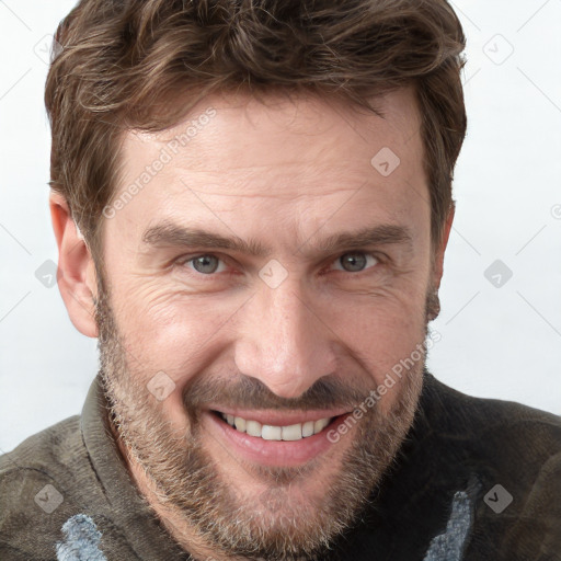 Joyful white adult male with short  brown hair and grey eyes