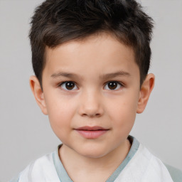 Joyful white child male with short  brown hair and brown eyes